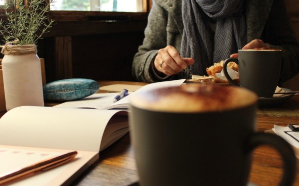 Meeting with coffee cups on table