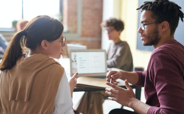 Two coworkers discussing