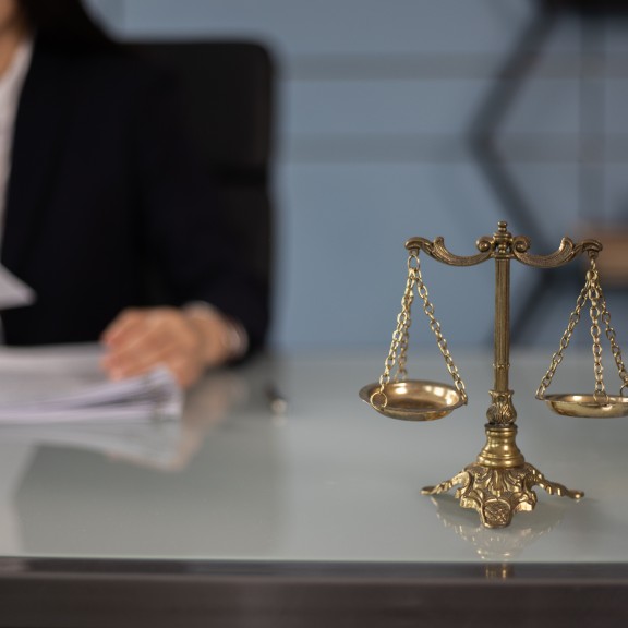 Justice scales on lawyer's desk