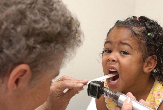 Doctor examining child