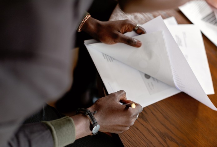 Person writing on paper